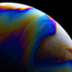 Illustration for article titled Photos of Soap Bubbles that Look Like Trippy Exoplanets